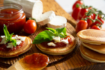 Pancakes with goat cheese and tomato jam.