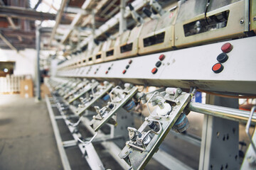 industrial stainless steel metal cotton weaving machines , machine weaving cotton for the fashion and textiles industry. Yarn weave traditional textile manufacturing mass production.