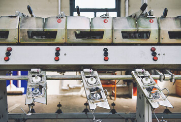 industrial stainless steel metal cotton weaving machines , machine weaving cotton for the fashion and textiles industry. Yarn weave traditional textile manufacturing mass production.