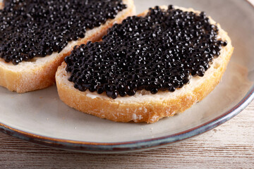 Black caviar over slices of  bread
