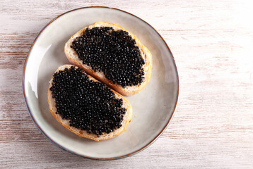 Black caviar over slices of  bread