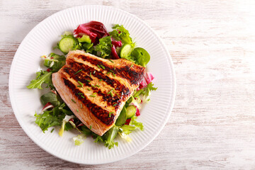 salmon fillet with salad