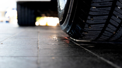 Tires of wet cars from washing cars, cars parked in shaded garages.