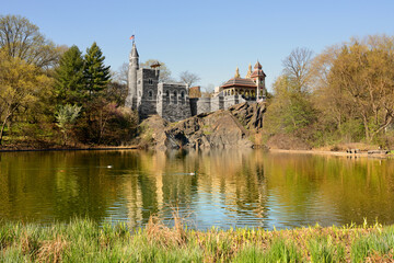 Belvedere Castle (1867-1869) on shore of Turtle Pond in Central Park on April sunny day, New York City