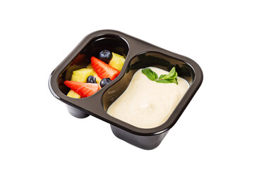 Dessert of applesauce, pineapple and strawberries in a plastic container on a white background.