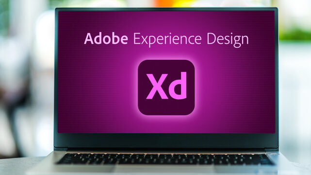 Laptop computer displaying logo of Adobe XD