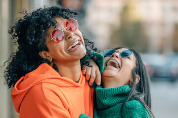 friends on the street laughing out loud