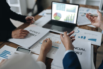Asian business advisor meeting to analyze and discuss the situation on the financial report in the meeting room.Investment Consultant, Financial , teamwork ,brainstorming ,startup and accounting