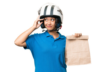 Young Argentinian woman taking a bag of takeaway food over isolated background having doubts and with confuse face expression
