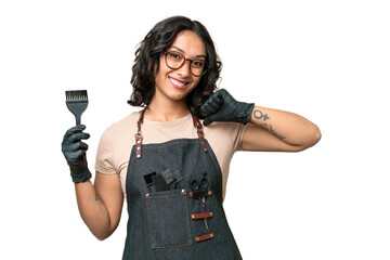 Young argentinian hairdresser woman over isolated background proud and self-satisfied