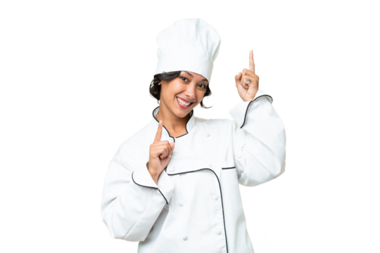 Young chef Argentinian woman over isolated background pointing finger to the laterals and happy