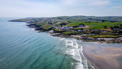 Seaside Irish landscape on a summer day, top view. Coastline with a beach.