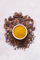 spices - curry, black pepper, cardamom, copy space
