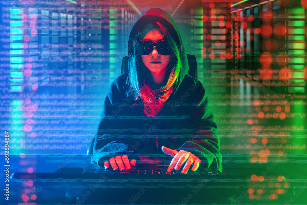 Poster woman programmer. girl hacker. woman in hood and sunglasses. girl develops software. programmer in s