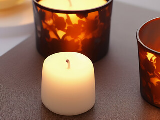 Obraz na płótnie Canvas Candles of different sizes and shapes on the table. Beautiful candles on a gray surface. Home interior. International Candlelight Day. Generated AI.