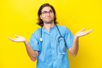 Young surgeon caucasian man isolated on yellow background having doubts while raising hands