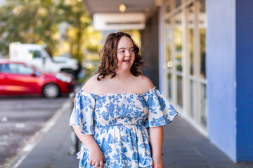 Portrait of seventeen year old girl with down syndrome in the community