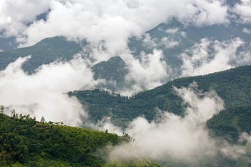 Beautiful view of clouds slowly rising in the morning in the mountains of Vietnam highlands