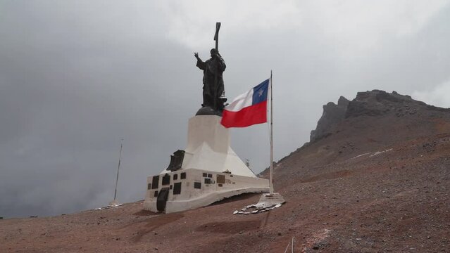 Mendoza, Argentina - 01 14 2019: Cristo Redentor monument on the border of the andes between Chile and Argentina, tall bronze statue of christ the redeemer on top of the mountain pass.