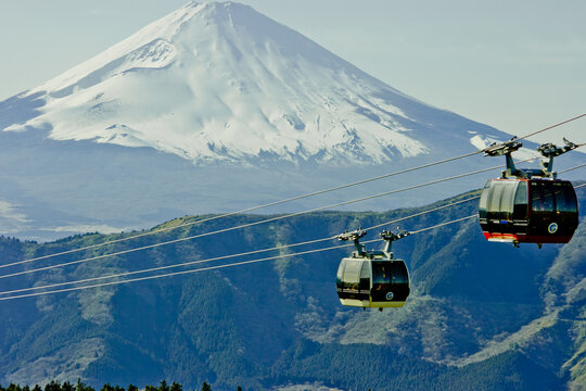 Two cable cars against the background of Mt. Fuji on a clear day. Hakone, Japan.
