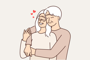 Elderly couple in love from gray-haired man and woman hugging and remembering youth or first date