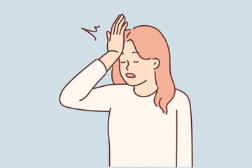 Woman makes gesture with facepalm putting palm to forehead, having learned about mistake made