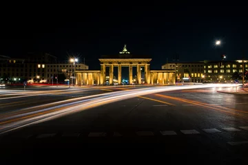 Fotobehang Centraal Europa Long exposure of car headlights and the beauty of Brandenburg Gate in Berlin at night