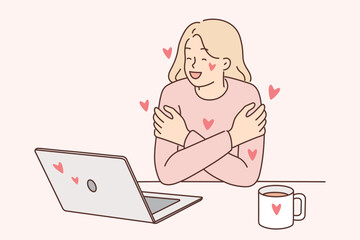 Woman exchanging romantic messages in laptops hugs herself rejoicing at received compliments  - obrazy, fototapety, plakaty