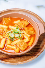 Tteokbokki, Stir-fried Rice Cake : Sliced rice cake bar (garaetteok) or thin rice cake sticks (Tteokbokkitteok) stir-fried in a spicy gochujang sauce with vegetables and fish cakes.