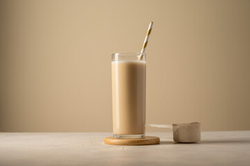 Protein powder and drink in a glass. Copy space.