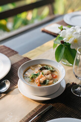 Famous Thai food on the wooden table, Tom Yum