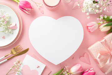 Fototapeta na wymiar Elegant Mother's day table concept. Top view flat lay of plates, cutlery, tulips, greeting card, gift box, and decorative hearts on pastel pink background with an empty heart for advertising or text