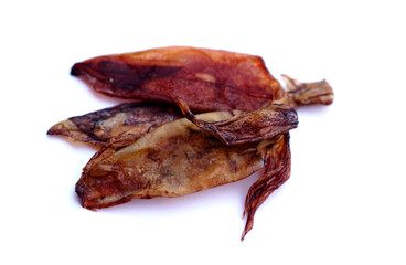 Dried squids for cooking isolated  on white background. Concept food preservation. Seafood. Dried on sunshine and keep for eating or selling. Delicious and can be cooked.                      