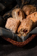Vertical high angle shot of pieces of traditional Colombian baked snacks in a basket