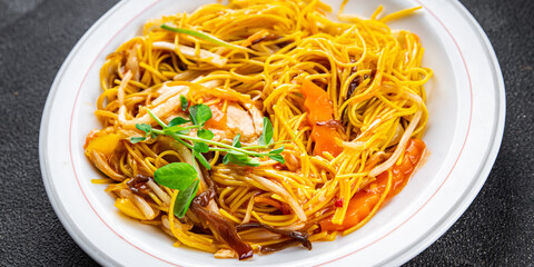 noodles chicken meat, vegetable meal food snack on the table copy space food background rustic top view