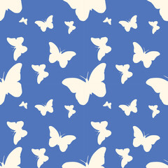 Beautiful seamless vector wallpaper with lovely white butterflies on a soft blue background