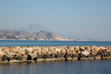 Stone Pier at El Campello Beach, Alicante; Spain - 592947175