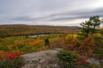 Fototapeta premium Autumnal view of the Porcupine Mountains State Park on a cloudy day in Ontonagon County, Michigan
