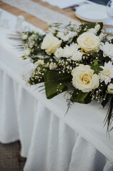 The set table for a wedding ceremony decorated with flowers, the concept of celebration of love
