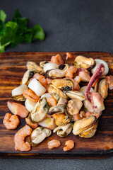 seafood salad shrimp, mussel, scallop, octopus meal food snack on the table copy space food background rustic top view 