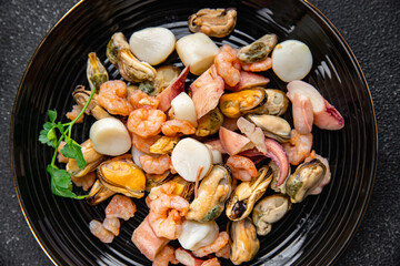 seafood salad shrimp, mussel, scallop, octopus meal food snack on the table copy space food background rustic top view 