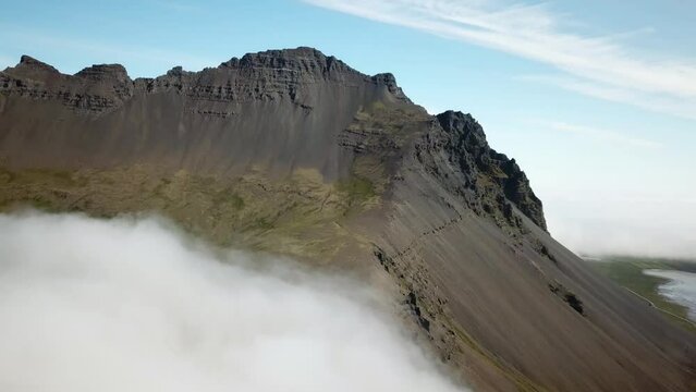 4K cinematic Aerial drone footage of Vestrahorn in Stokksnes. Iceland landscape with stunning mountains hidden in the mist. High quality 4k footage