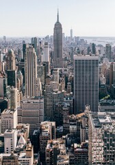 Fototapeta na wymiar Vertical shot of the Empire State Building against blue sky in New York, USA