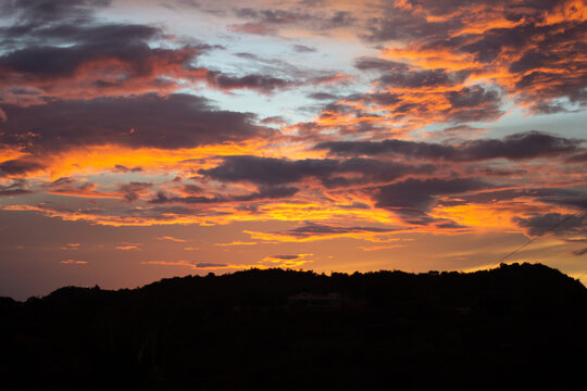 red sunset sky and mountains