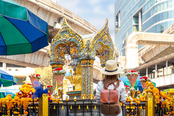 Asian woman travel in erawan shrine Bangkok city