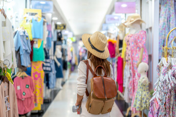 Asian woman travel and shoping in and walking in Platinum market in Bangkok city