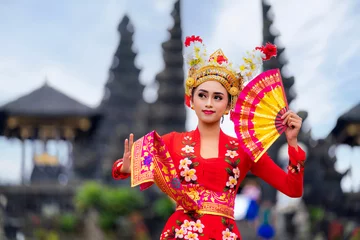 Fototapeten Bali Indonesian girl with traditional costumn dance in bali temple  © anekoho