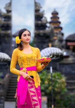 Indonesian girl with traditional costumn dance in bali temple