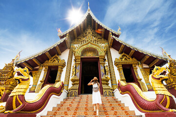 Fototapeta na wymiar Asian traveller take a photo to Pagoda of wat lok moli temple in Chiang mai