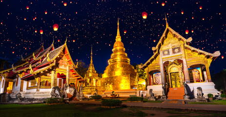 wat phra singh temple in night time in raining season in Chiang mai city - Powered by Adobe